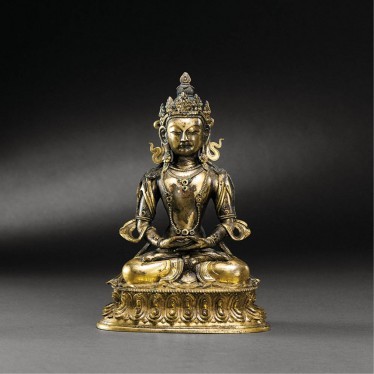 A GILT-BRONZE FIGURE OF AMITAYUS